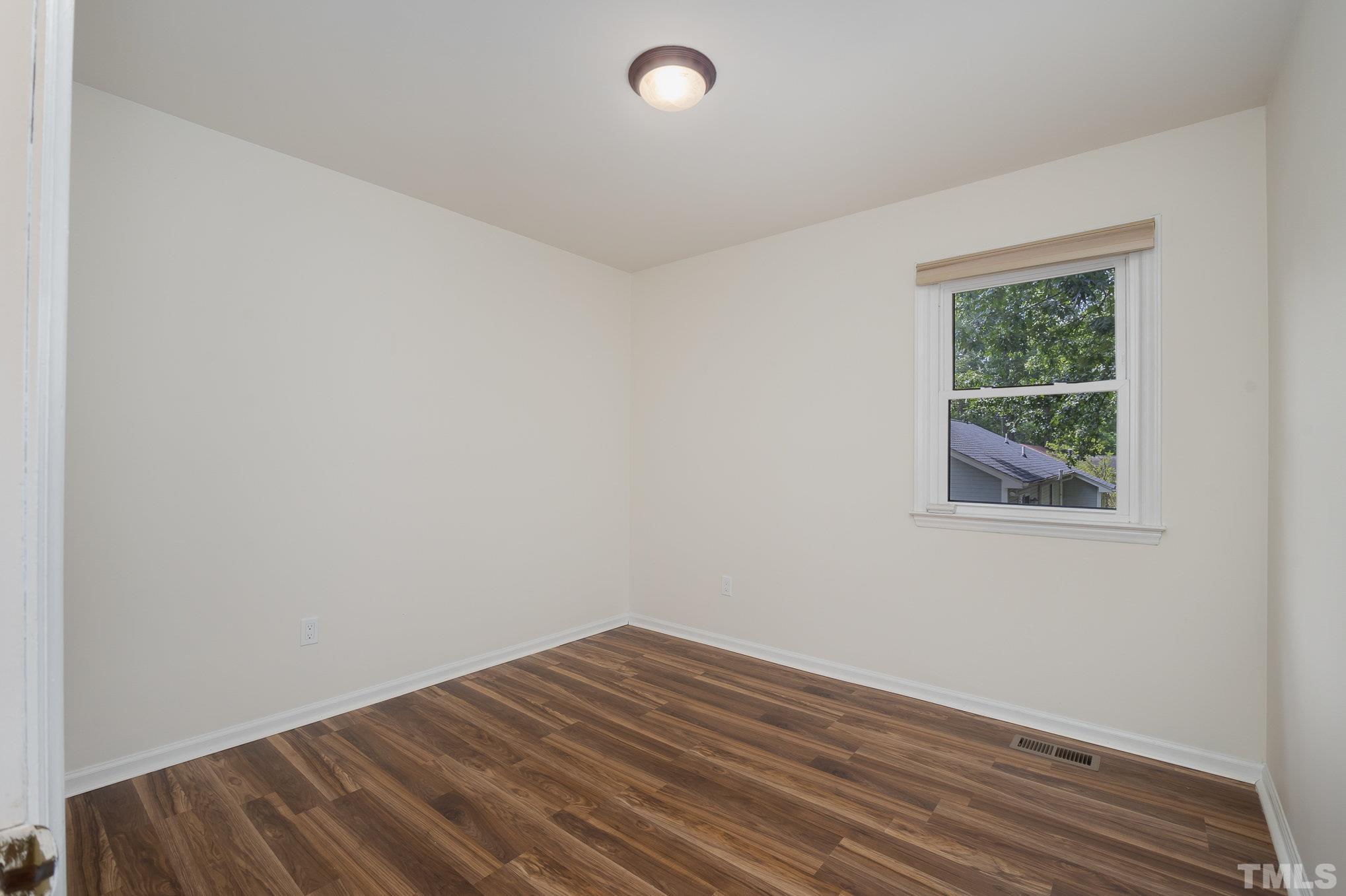 2411 Wade Hampton Road Hillsborough, NC 27278 - Photo 12 of 21 an empty room with a window