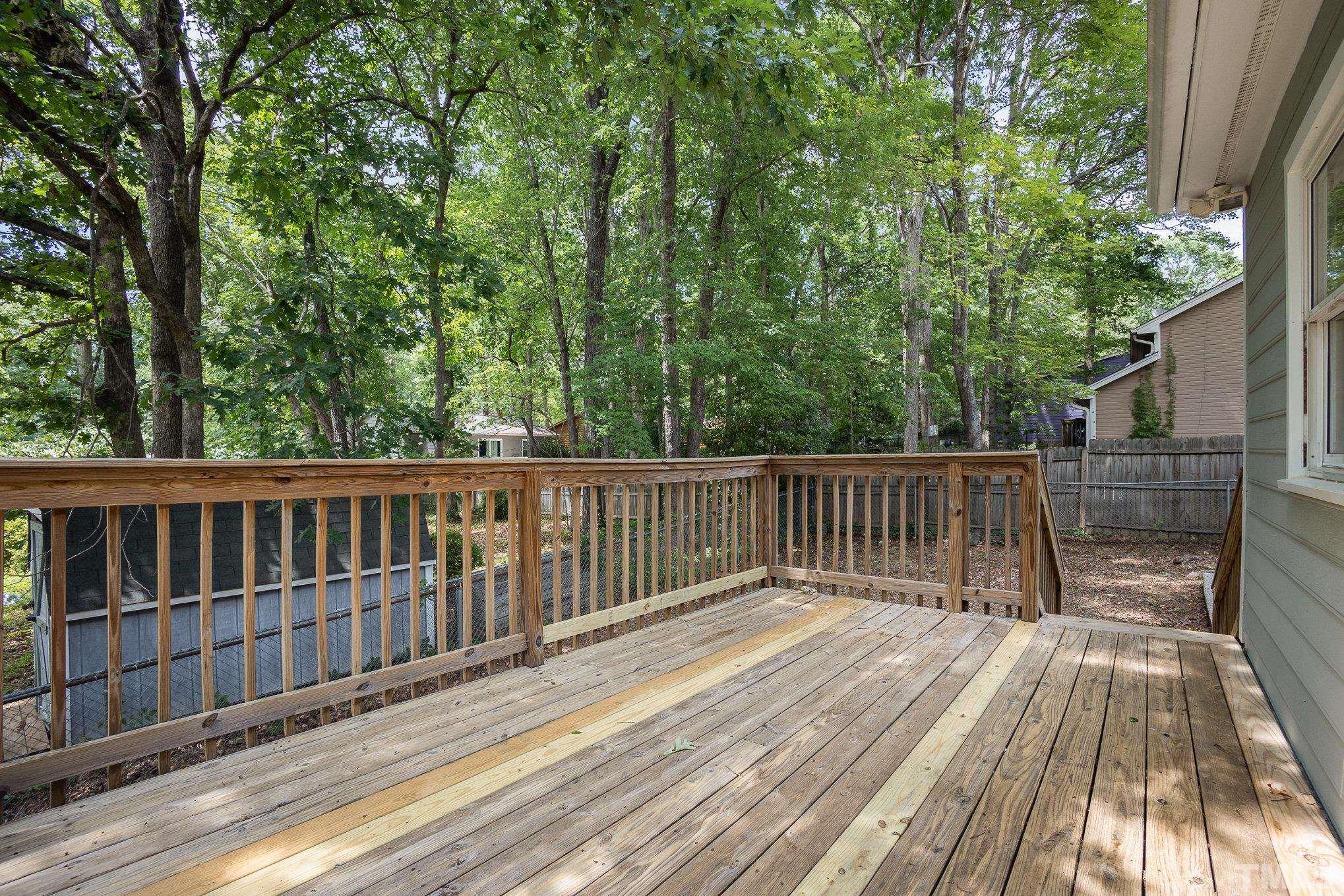 2411 Wade Hampton Road Hillsborough, NC 27278 - Photo 18 of 21 a view of balcony with wooden floor and fence