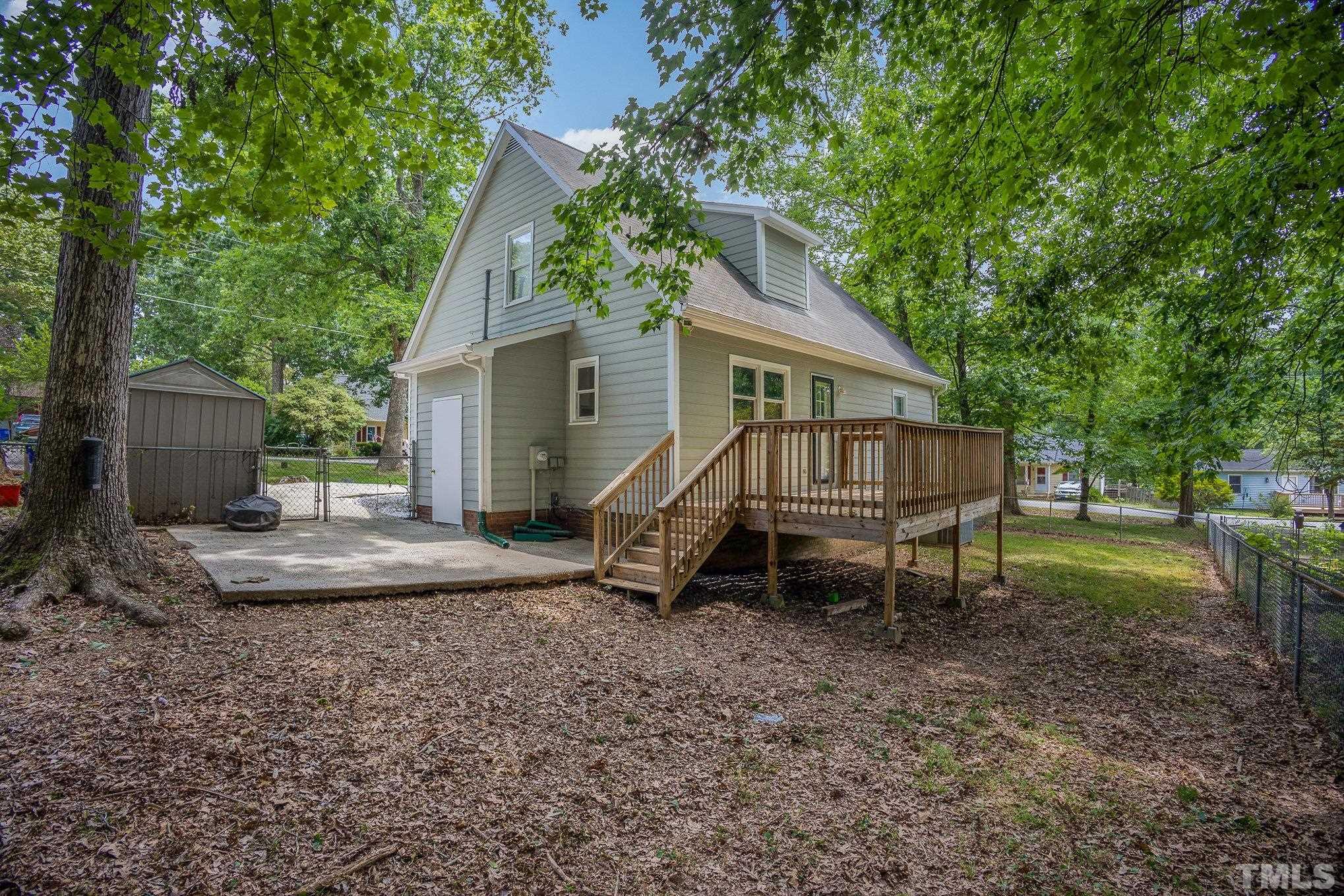 2411 Wade Hampton Road Hillsborough, NC 27278 - Photo 19 of 21 a view of a house with a yard and sitting area