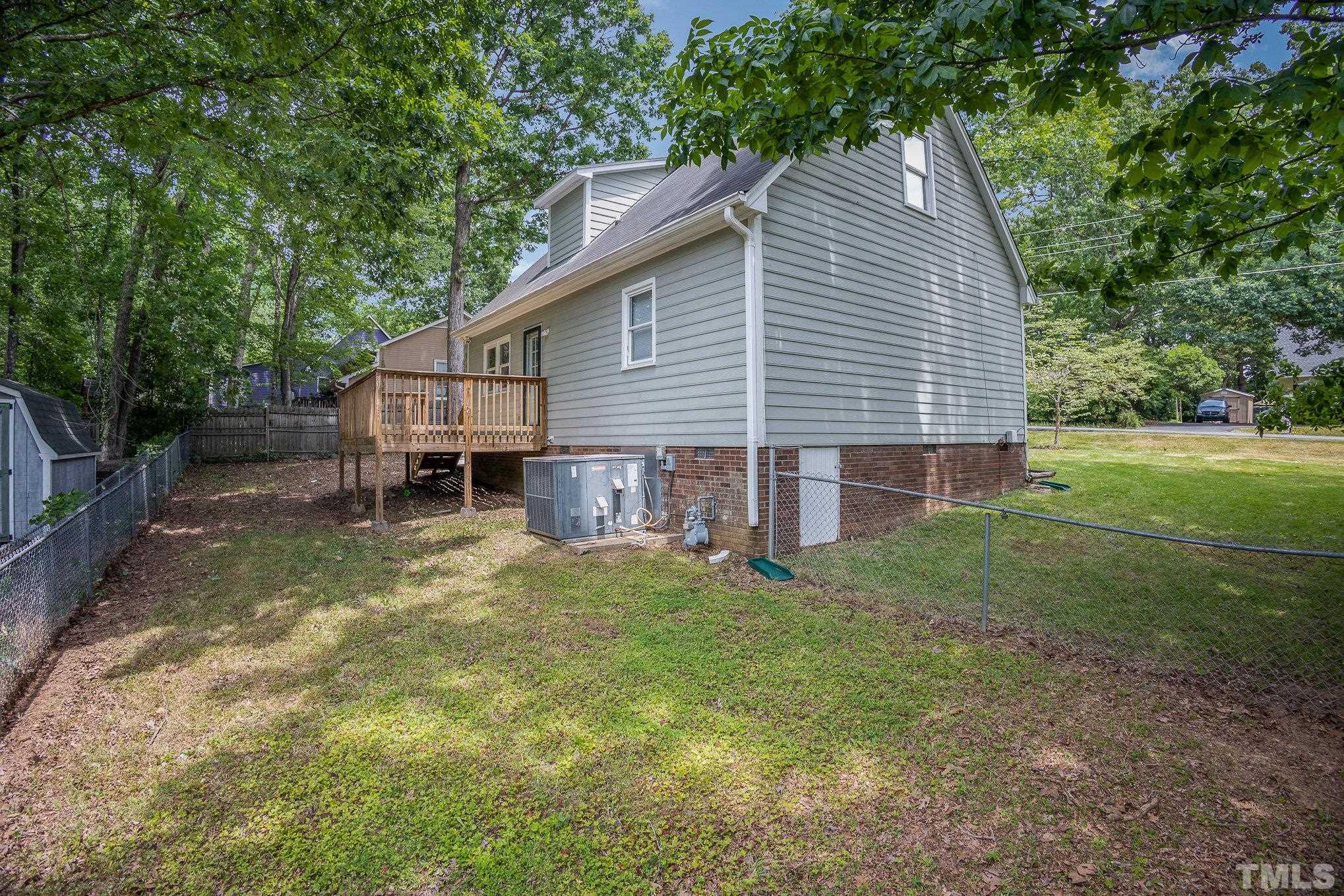 2411 Wade Hampton Road Hillsborough, NC 27278 - Photo 20 of 21 a view of a house with a yard and sitting area