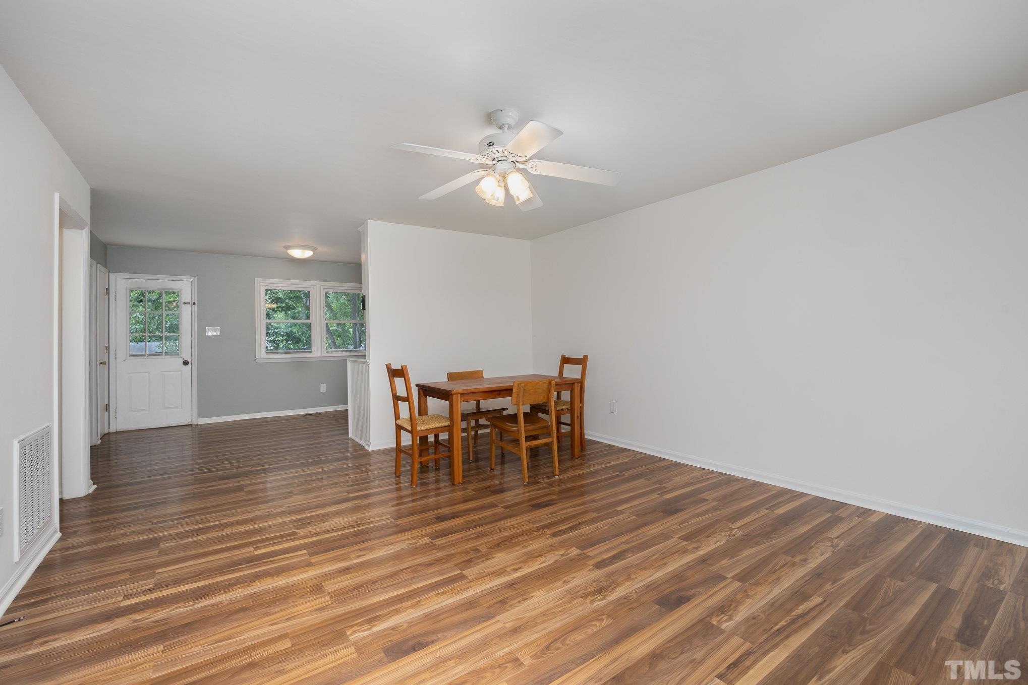 2411 Wade Hampton Road Hillsborough, NC 27278 - Photo 4 of 21 a view of a dining room with furniture and chandelier