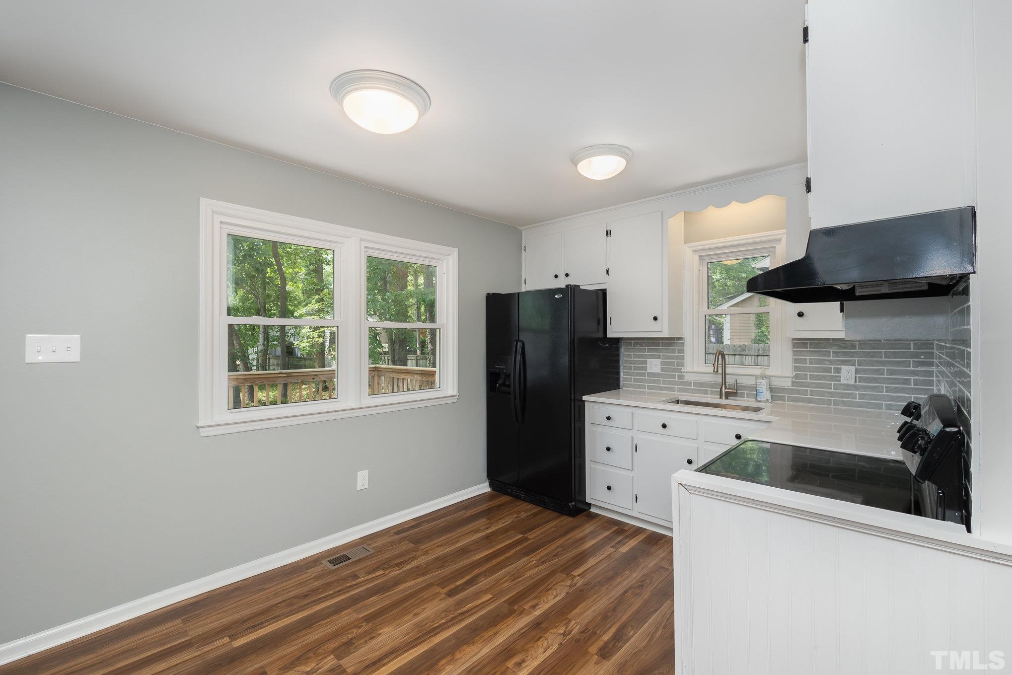 2411 Wade Hampton Road Hillsborough, NC 27278 - Photo 5 of 21 a kitchen with a refrigerator and a sink