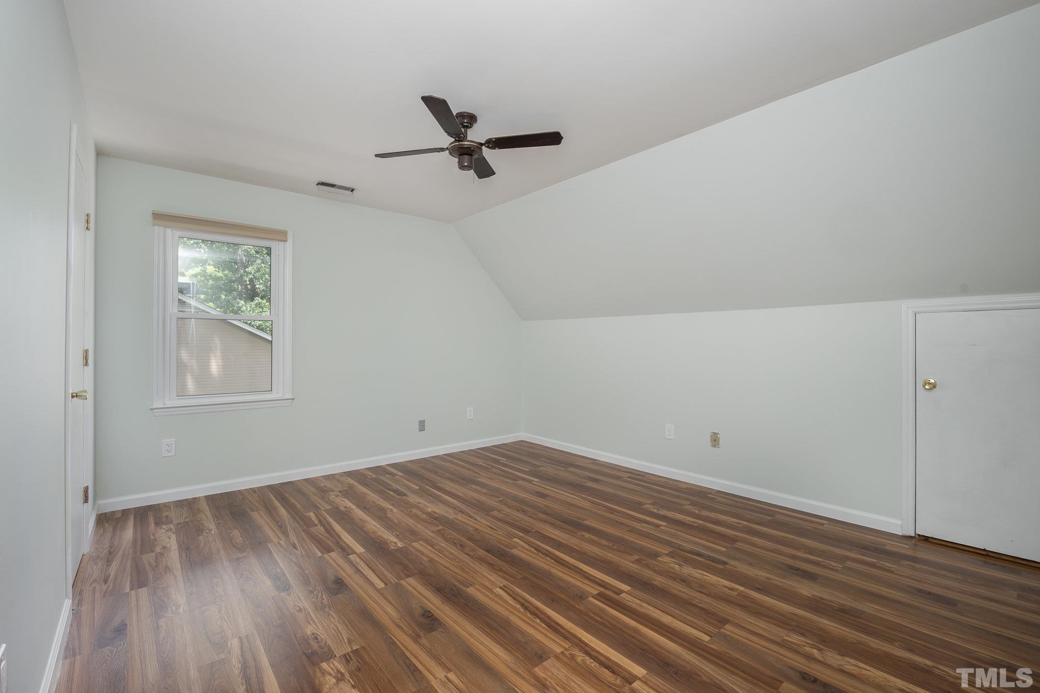 2411 Wade Hampton Road Hillsborough, NC 27278 - Photo 7 of 21 an empty room with wooden floor closet and windows