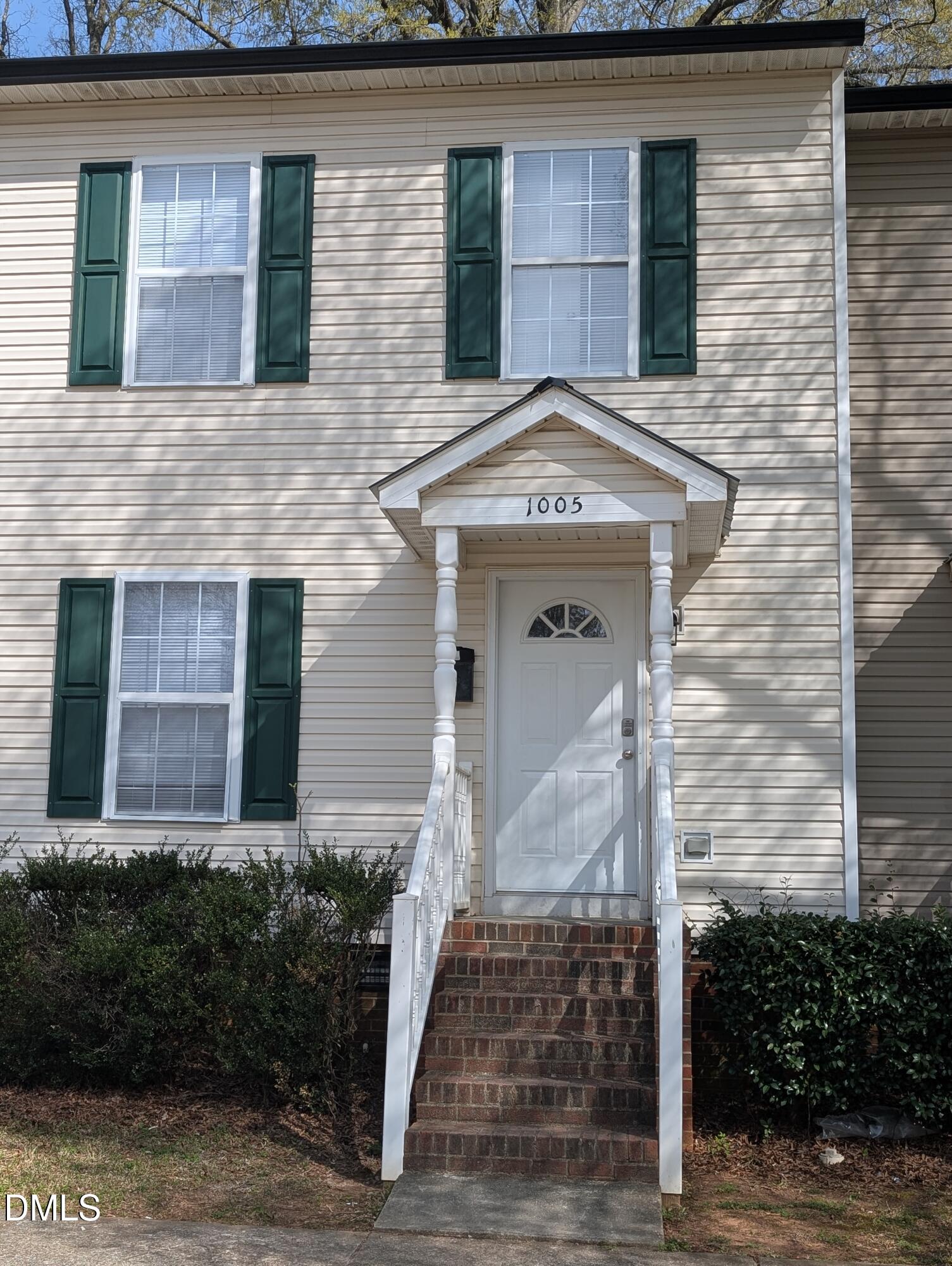 1005 Shades Place Raleigh, NC 27601 - Photo 2 of 18 a front view of a house with garden