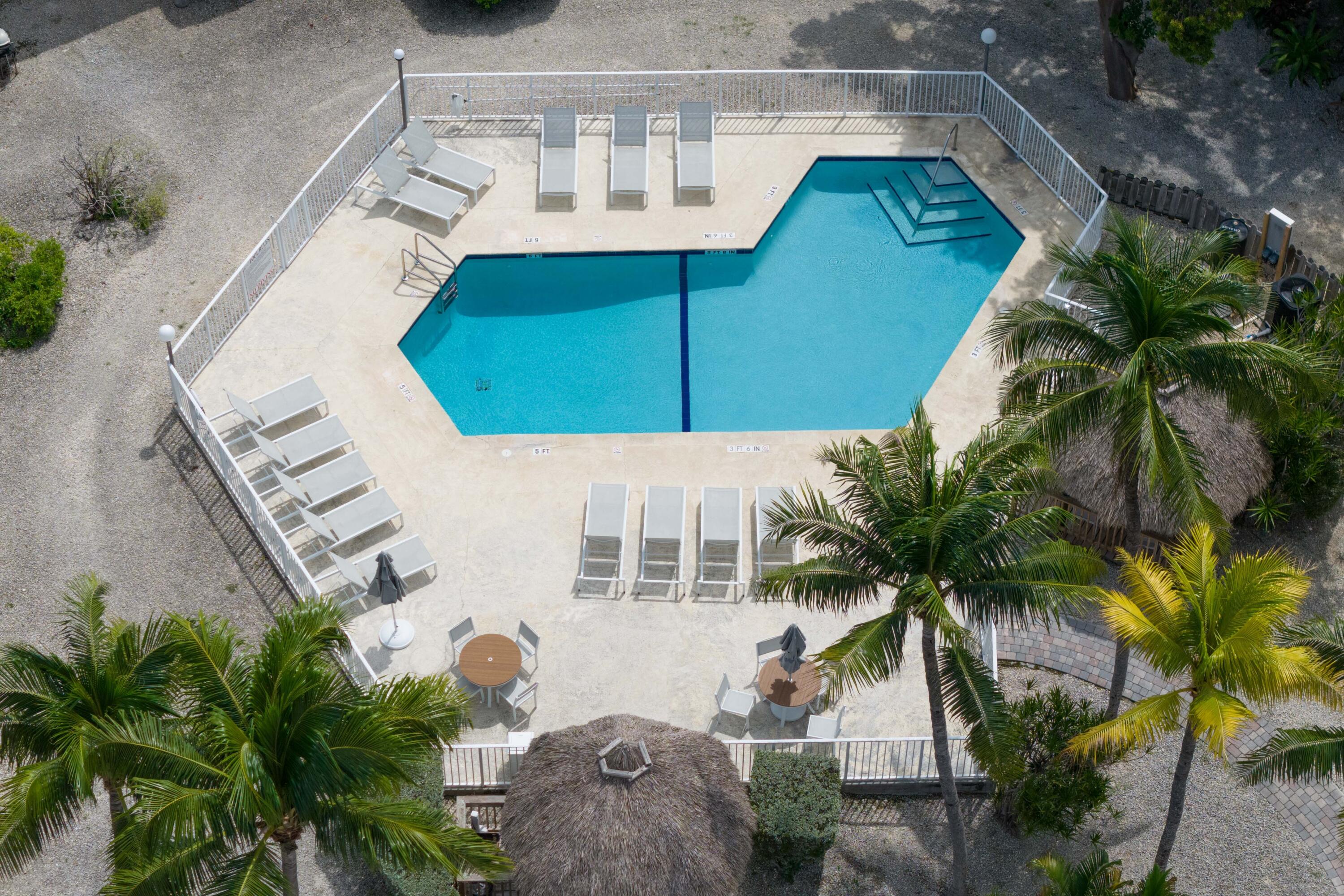 98222 Windward Avenue Key Largo, FL 33037 - Photo 34 of 41 a picture of a building with a yard