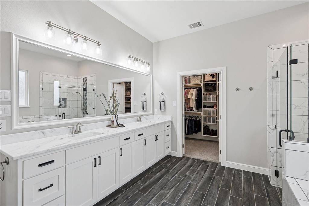 112 Friendship Way Boyd, TX 76023 - Photo 17 of 29 Dual vanity featuring white shaker cabinetry and white countertops