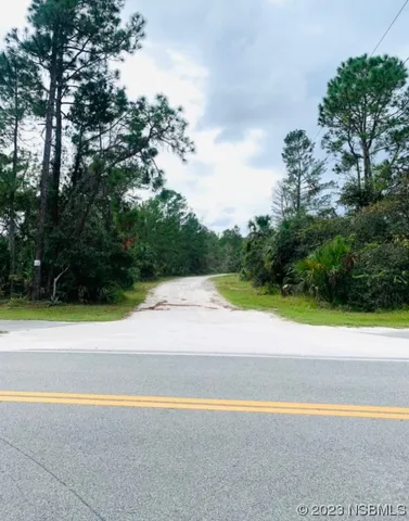 a view of a swimming pool and green space