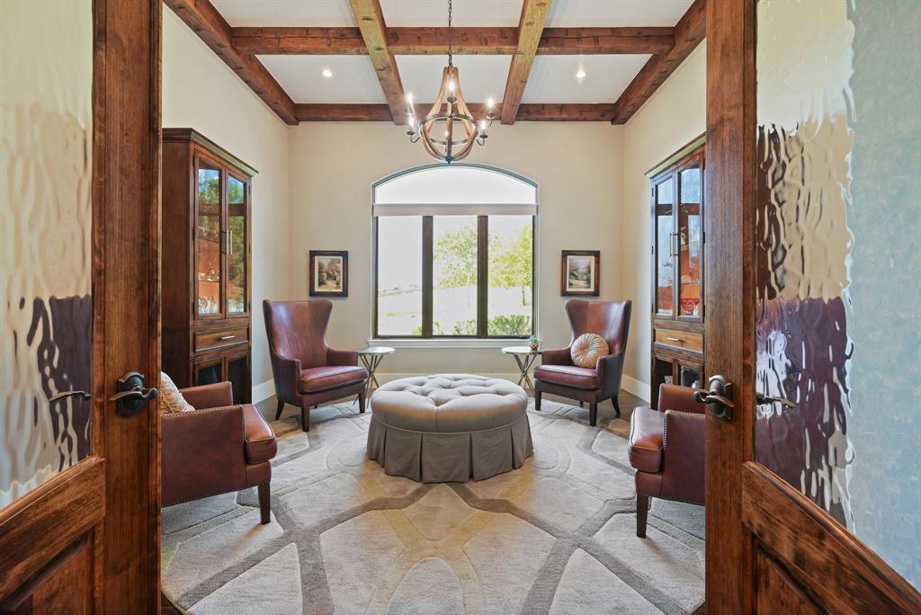 325 River Ridge Spring Branch, TX 78070 - Photo 19 of 40 a living room with furniture a chandelier and a large mirror