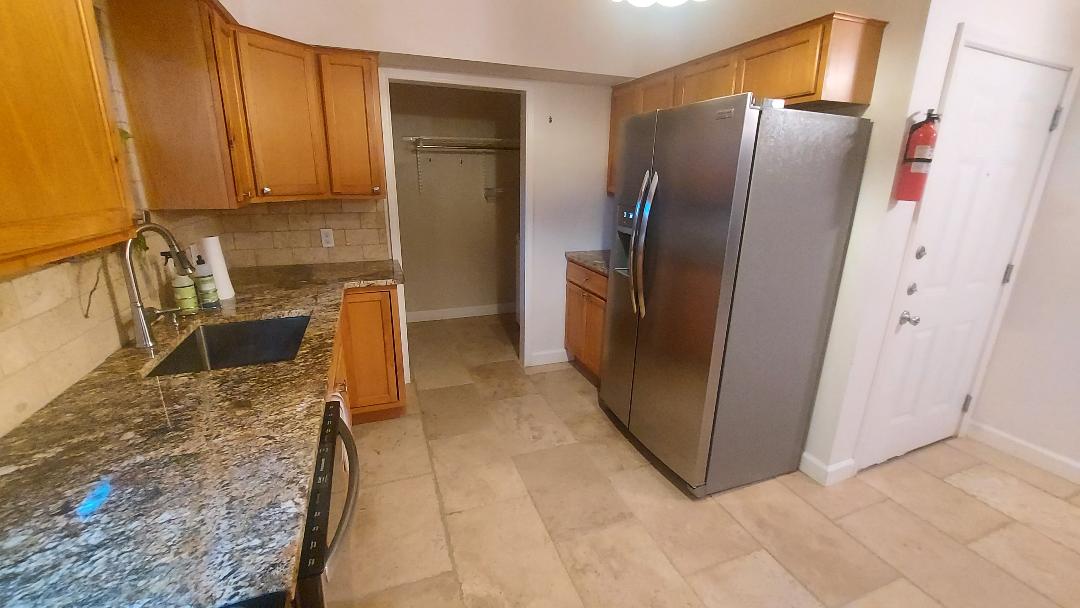 1807 Barbara Street Austin, TX 78757 - Photo 12 of 25 a kitchen with stainless steel appliances granite countertop a refrigerator and a stove