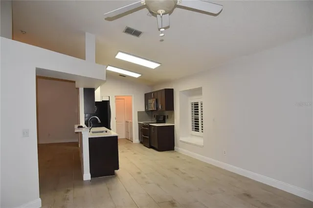 a kitchen with stainless steel appliances a stove and a refrigerator