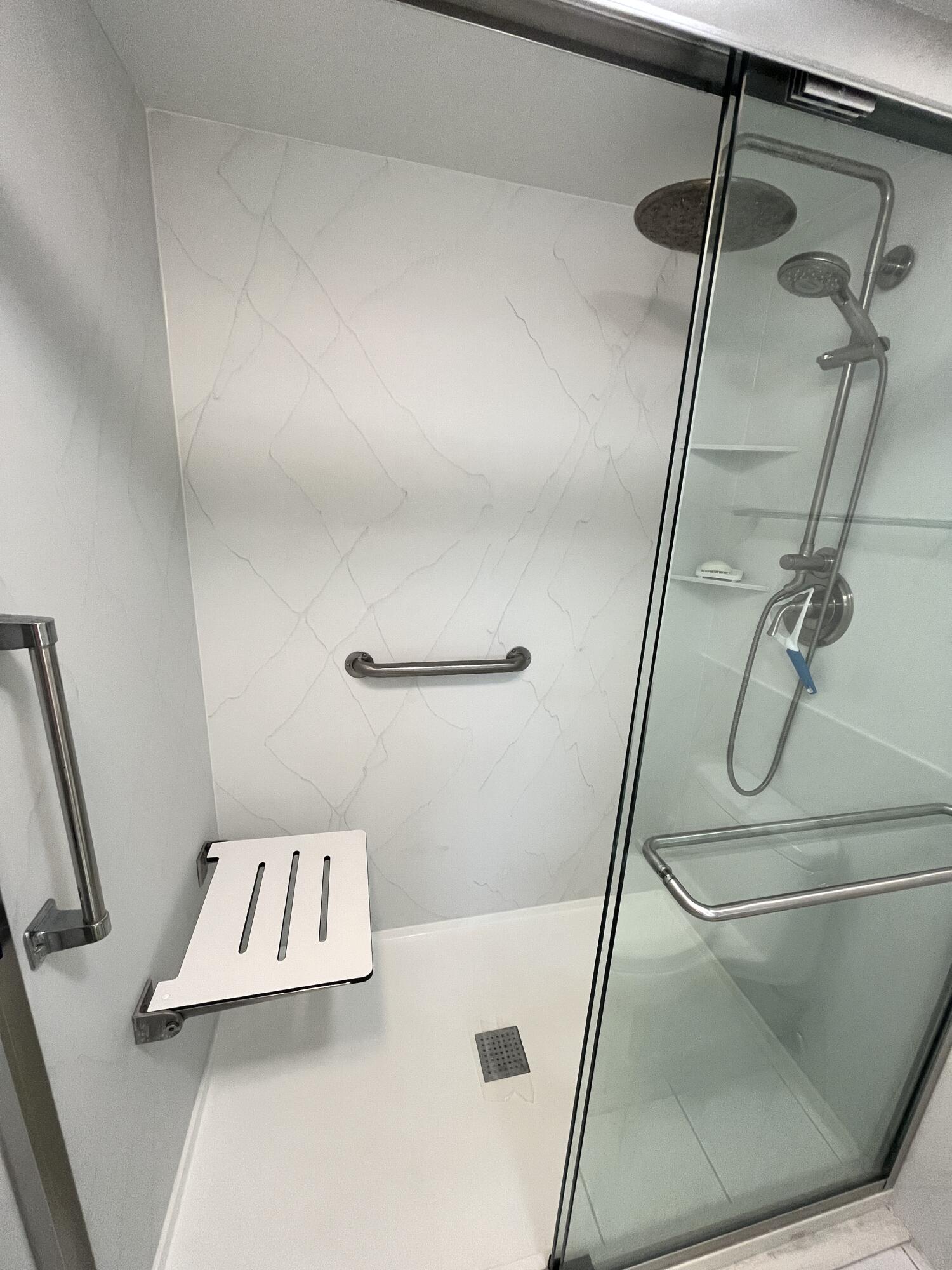 308 Golfview Road, Unit 107 North Palm Beach, FL 33408 - Photo 12 of 34 Remodeled shower with a bench