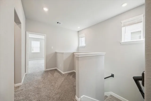 a view of a hallway with closet