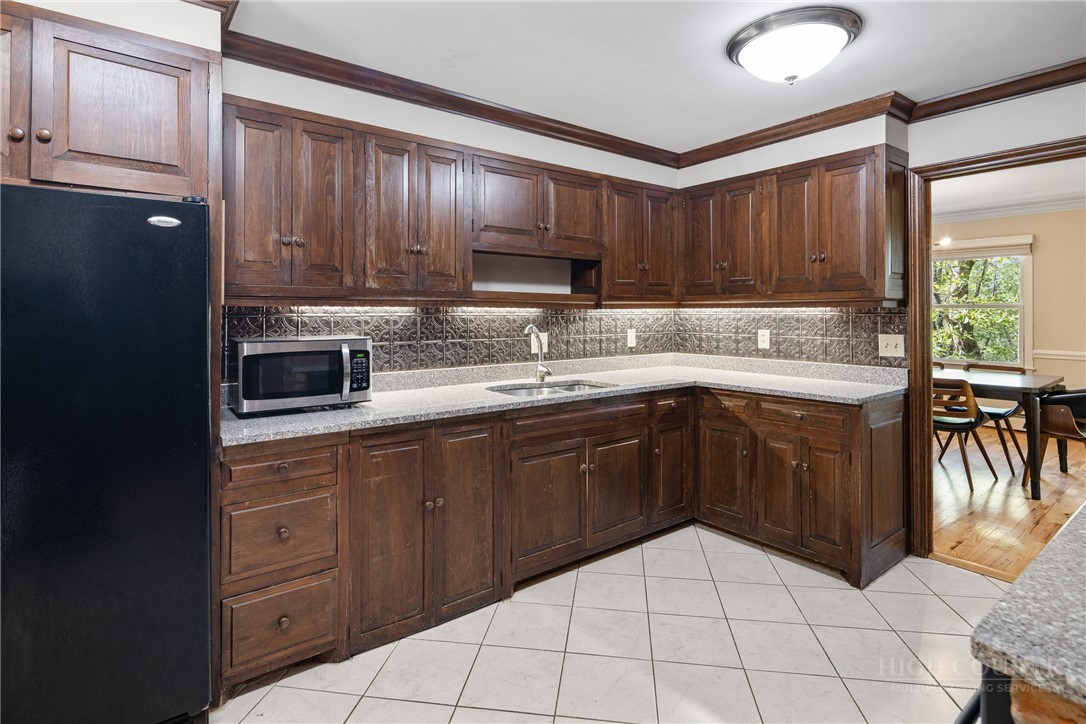 239 Eagle Drive Boone, NC 28607 - Photo 12 of 41 a kitchen with a sink a stove and cabinets