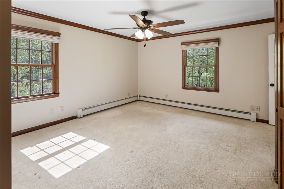 239 Eagle Drive Boone, NC 28607 - Photo 16 of 41 an empty room with windows and fan