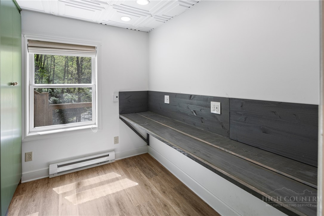 239 Eagle Drive Boone, NC 28607 - Photo 26 of 41 a view of a room with wooden floor and windows