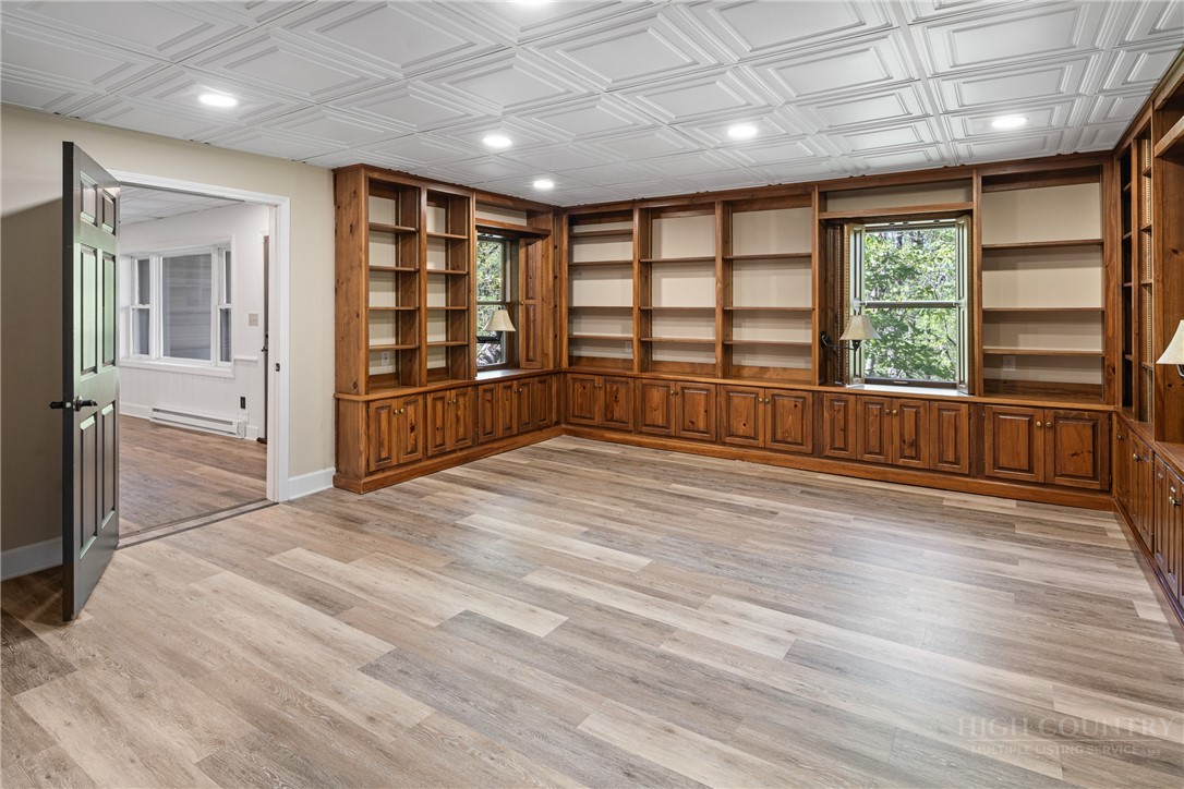 239 Eagle Drive Boone, NC 28607 - Photo 30 of 41 a view of an empty room with a window and wooden floor