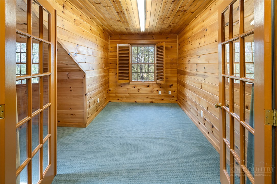 239 Eagle Drive Boone, NC 28607 - Photo 37 of 41 a view of an entryway with wooden floor and windows