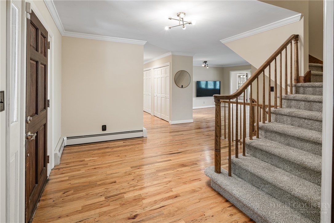 239 Eagle Drive Boone, NC 28607 - Photo 4 of 41 a view of a hallway with wooden floor and staircase