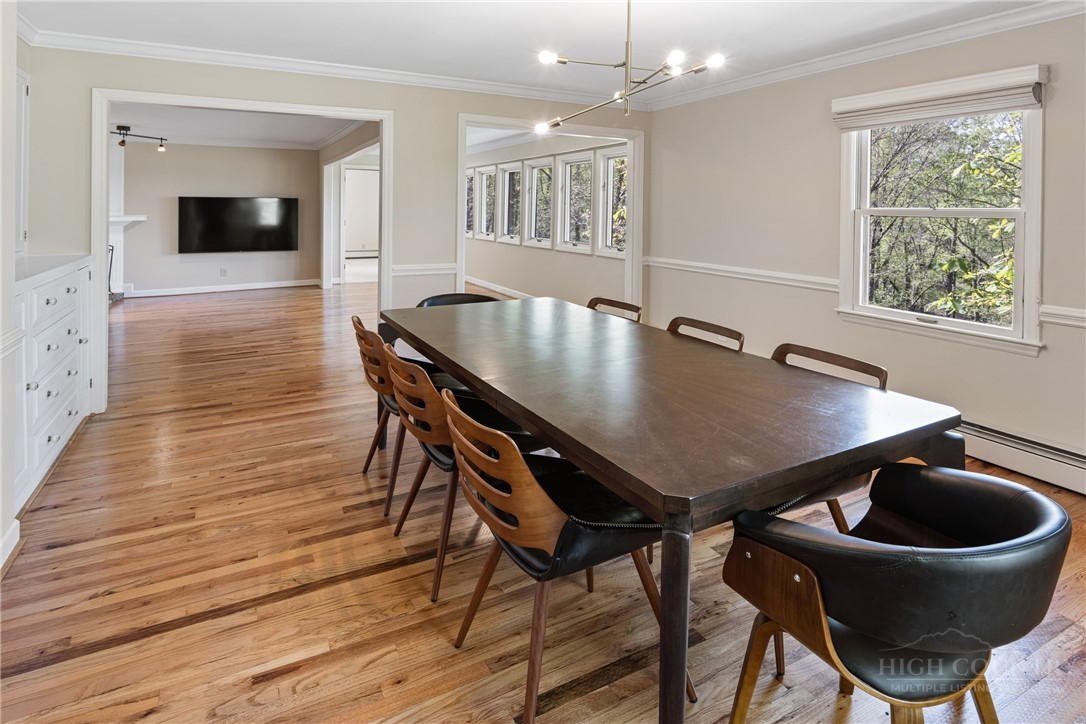 239 Eagle Drive Boone, NC 28607 - Photo 8 of 41 a view of a dining room with furniture and wooden floor