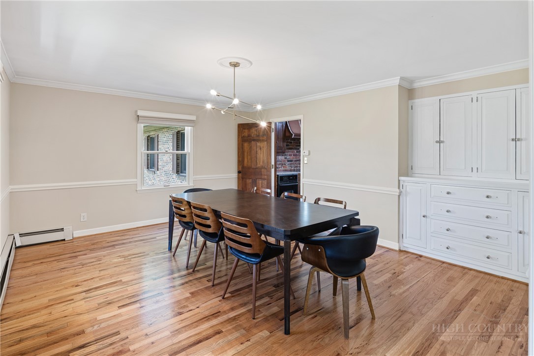 239 Eagle Drive Boone, NC 28607 - Photo 9 of 41 a view of a dining room with furniture and wooden floor