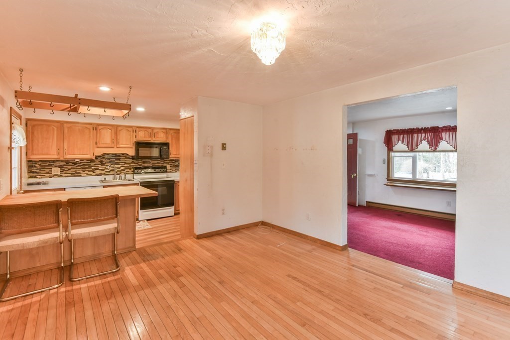 136 Pierpont Road Dudley, MA 01571 - Photo 17 of 28 a view of a kitchen with a sink and a stove top oven