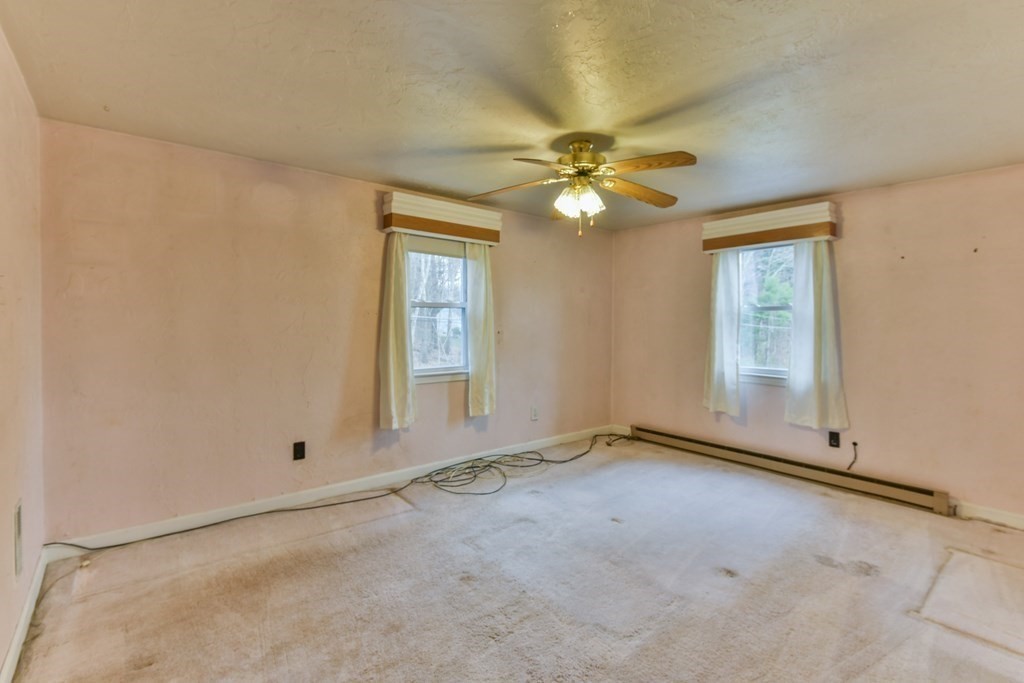136 Pierpont Road Dudley, MA 01571 - Photo 24 of 28 an empty room with windows and fan