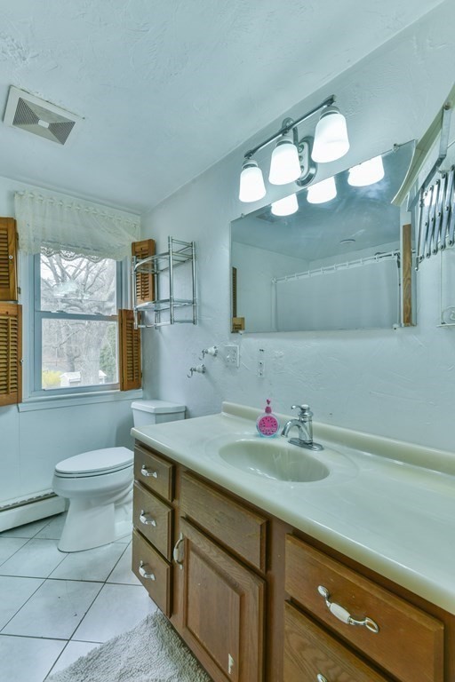 136 Pierpont Road Dudley, MA 01571 - Photo 28 of 28 a bathroom with a sink a vanity and a mirror