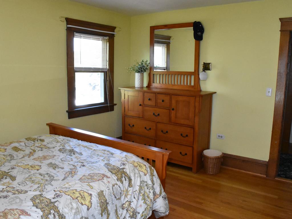 655 Chestnut Street Meadville, PA 16335 - Photo 27 of 43 a bedroom with a bed and wooden floor