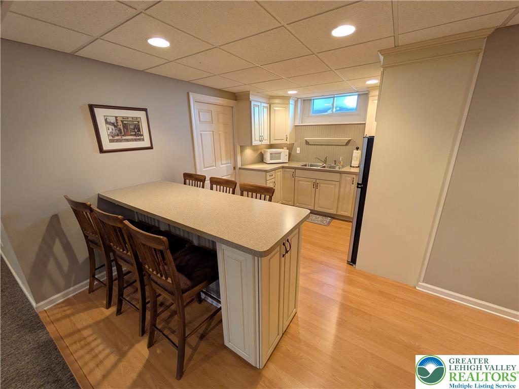 3285 Cherryville Road Northampton, PA 18067 - Photo 34 of 51 Smooth laminate floors and recessed lighting enhance this versatile lower level kitchen space.