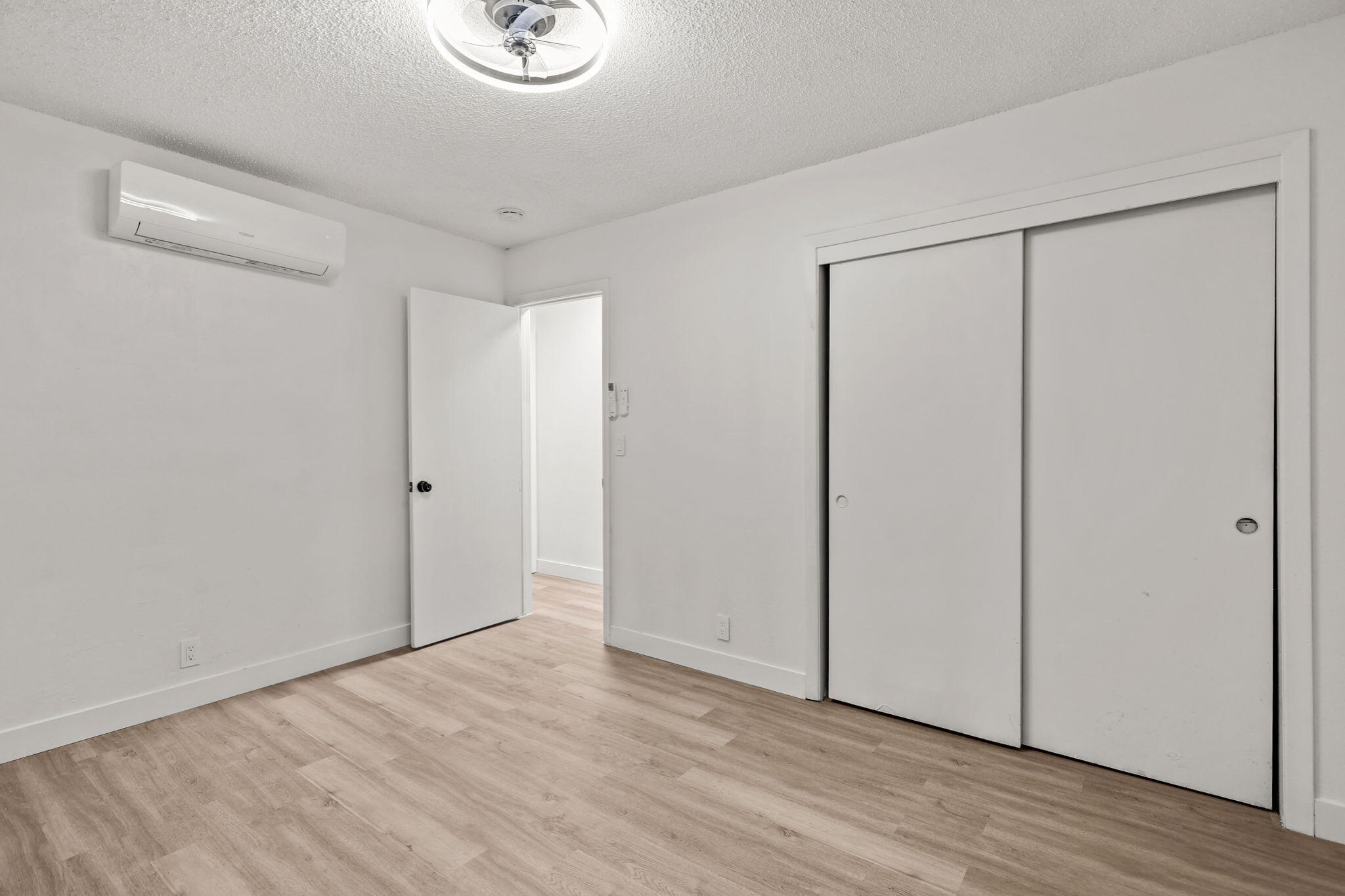 3200 Franklin Street Anderson, CA 96007 - Photo 13 of 35 a view of an empty room with wooden floor and a window