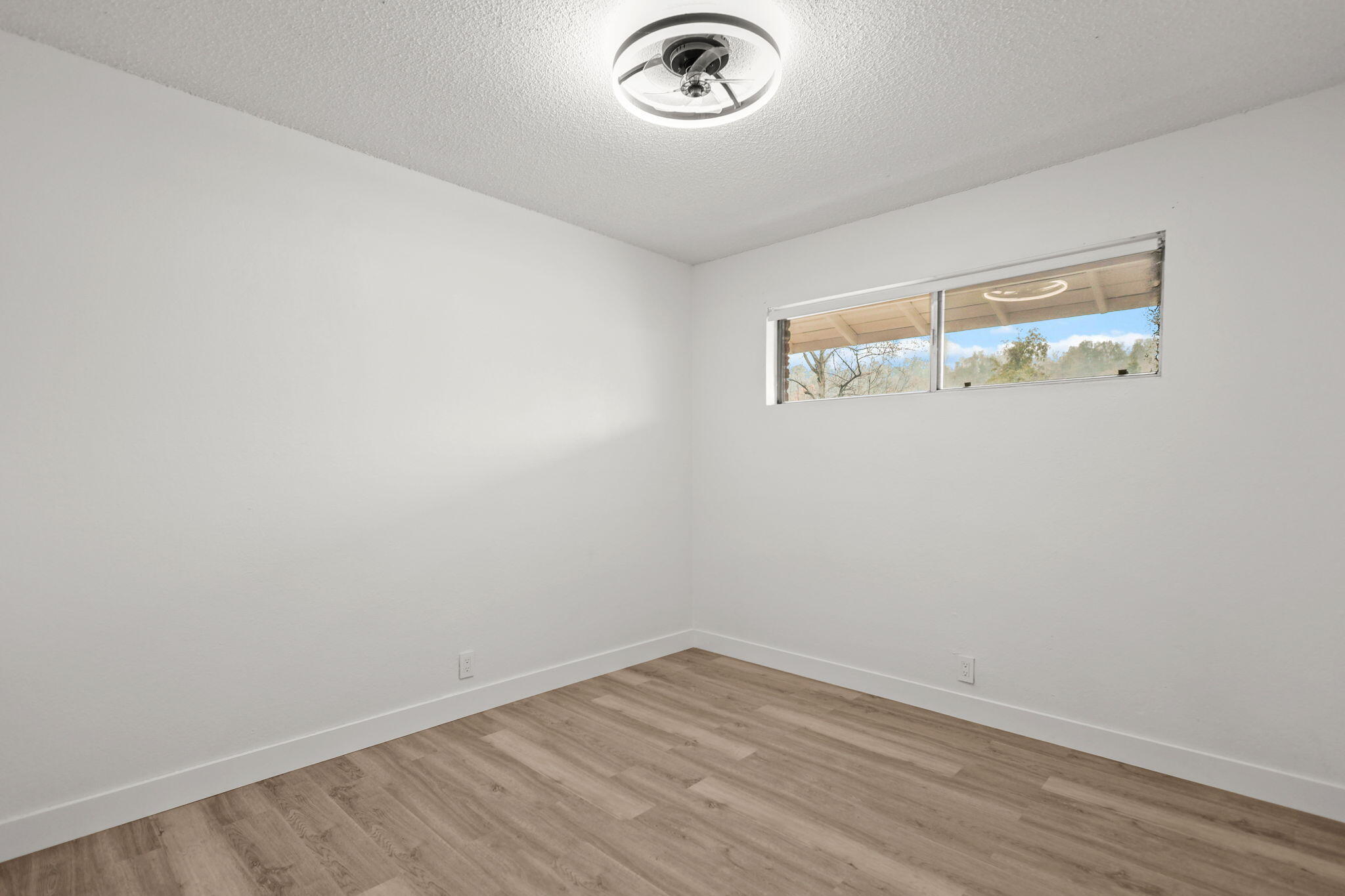3200 Franklin Street Anderson, CA 96007 - Photo 17 of 35 a view of a hallway with wooden floor