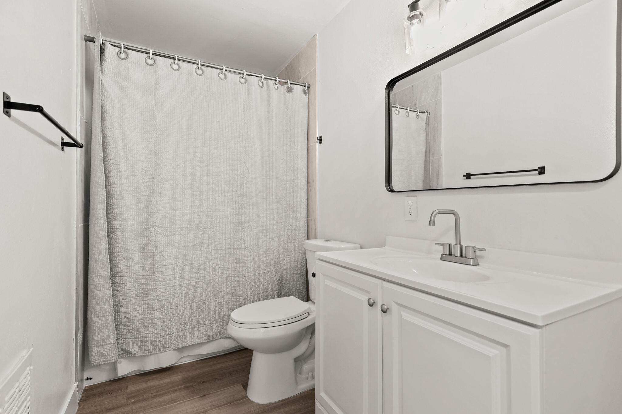3200 Franklin Street Anderson, CA 96007 - Photo 29 of 35 a bathroom with a sink vanity mirror and toilet