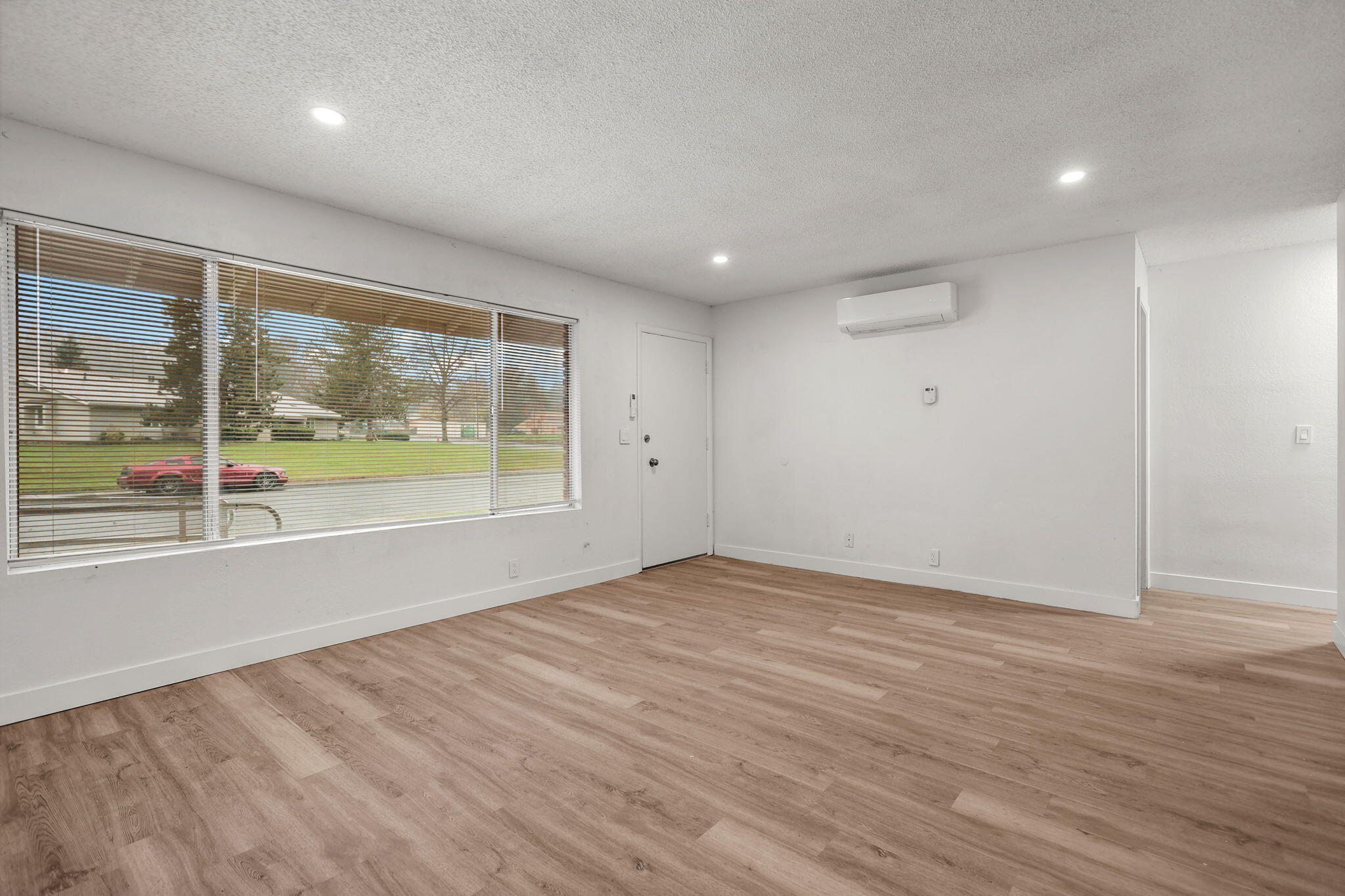 3200 Franklin Street Anderson, CA 96007 - Photo 4 of 35 a view of an empty room with wooden floor and a window
