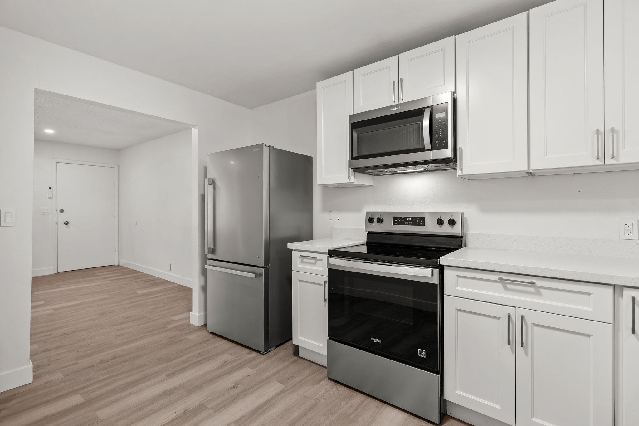 3200 Franklin Street Anderson, CA 96007 - Photo 7 of 35 a kitchen with cabinets stainless steel appliances and wooden floor