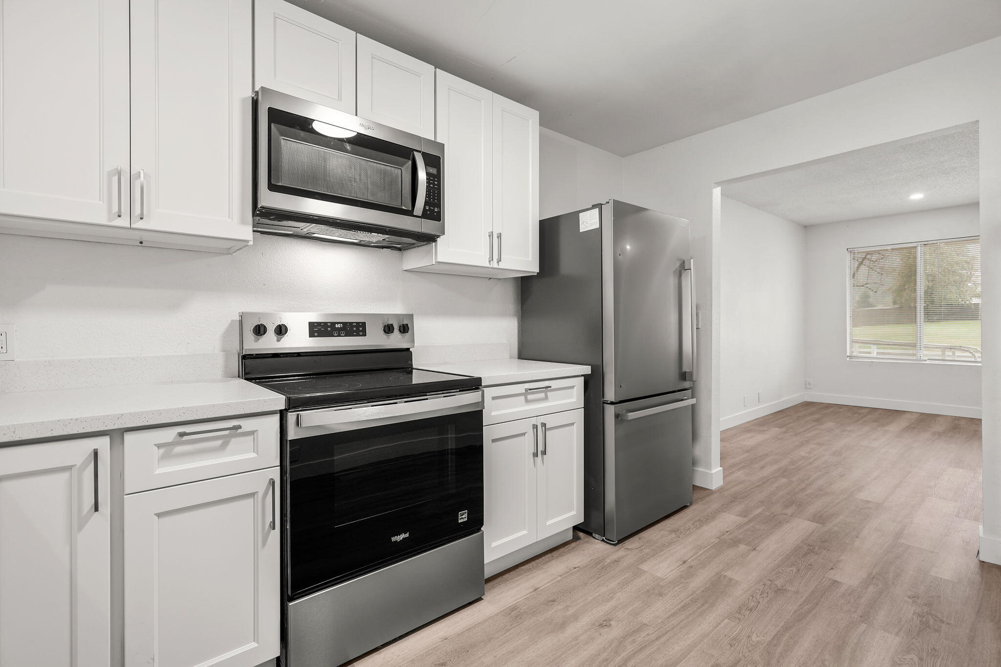 3200 Franklin Street Anderson, CA 96007 - Photo 10 of 35 a kitchen with stainless steel appliances granite countertop a refrigerator stove and microwave