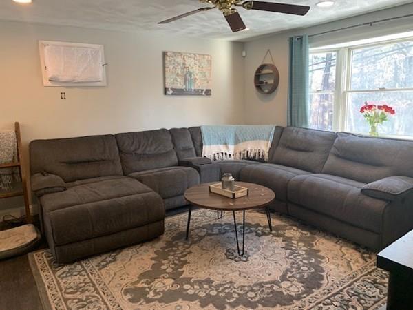 184 Baldwin Road Billerica, MA 01821 - Photo 8 of 17 a living room with furniture and a rug