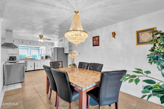 a living room with furniture a dining table and chairs