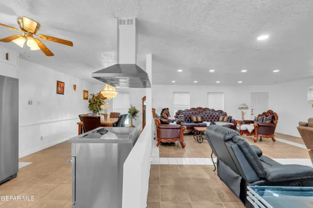 a kitchen with stainless steel appliances a sink a stove and a refrigerator