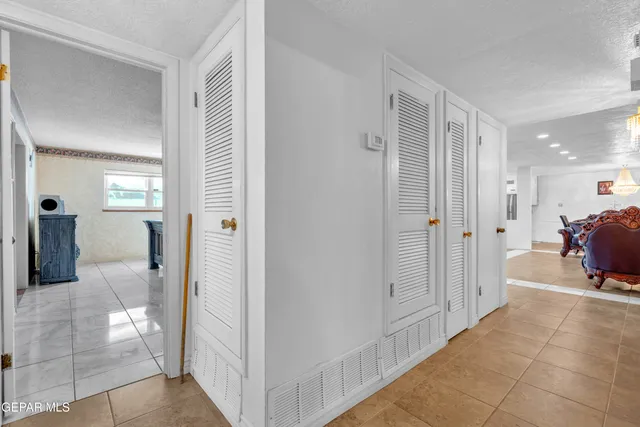 a bed room with a bed and a television