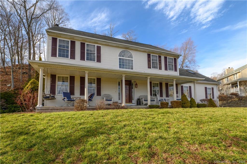 28 Robby Lane East Haven, CT 06512 - Photo 1 of 1 a front view of a building with garden and porch