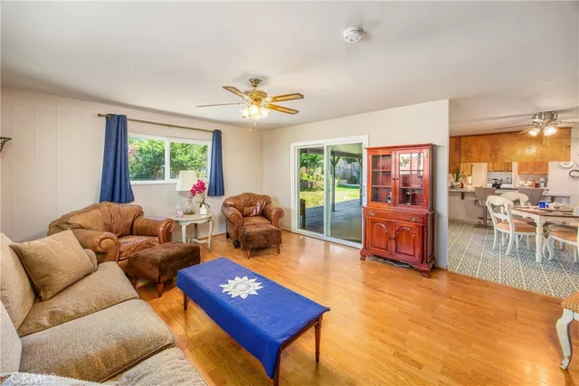 a living room with furniture a fireplace and a table