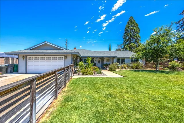 a view of a house with a yard