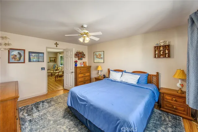 a bed room with a bed and a chandelier