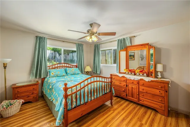 a bedroom with double bed and a chandelier