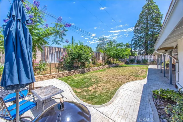 a view of a backyard with sitting area