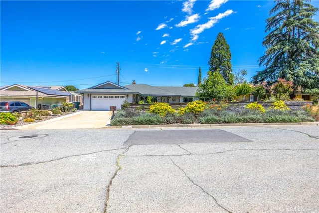 a view of a street with a building in the background