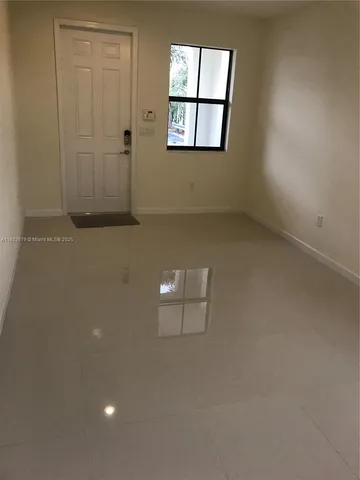 an empty room with a staircase