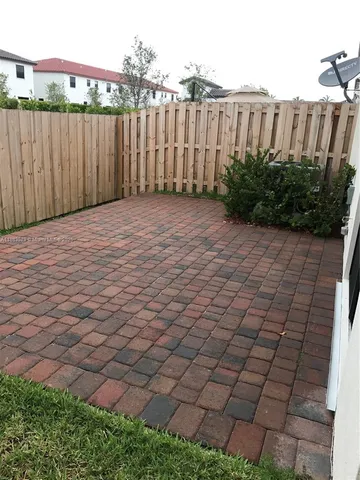 a bathroom with a double vanity sink and mirror
