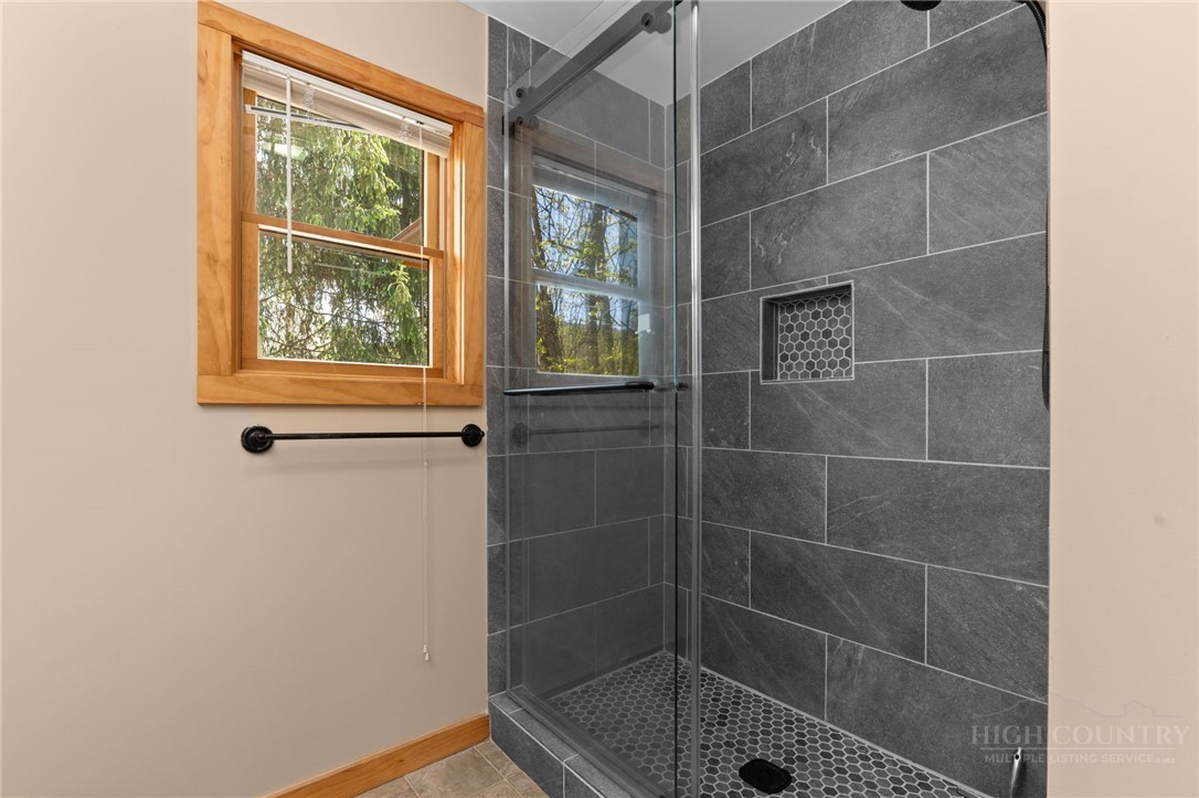 148 Woodby Ridge Road Vilas, NC 28692 - Photo 20 of 33 a bathroom with a shower
