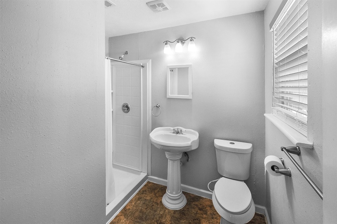 16766 Lake Circle Conroe, TX 77302 - Photo 14 of 22 a white toilet sitting next to a bathroom sink